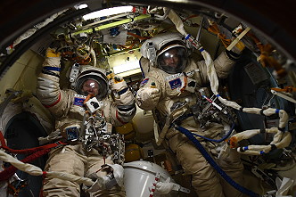 Oleg Novitsky and Pyotr Dubrov in Orlan spacesuits