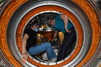 Oleg Novitsky and Pyotr Dubrov open the Nauka hatch